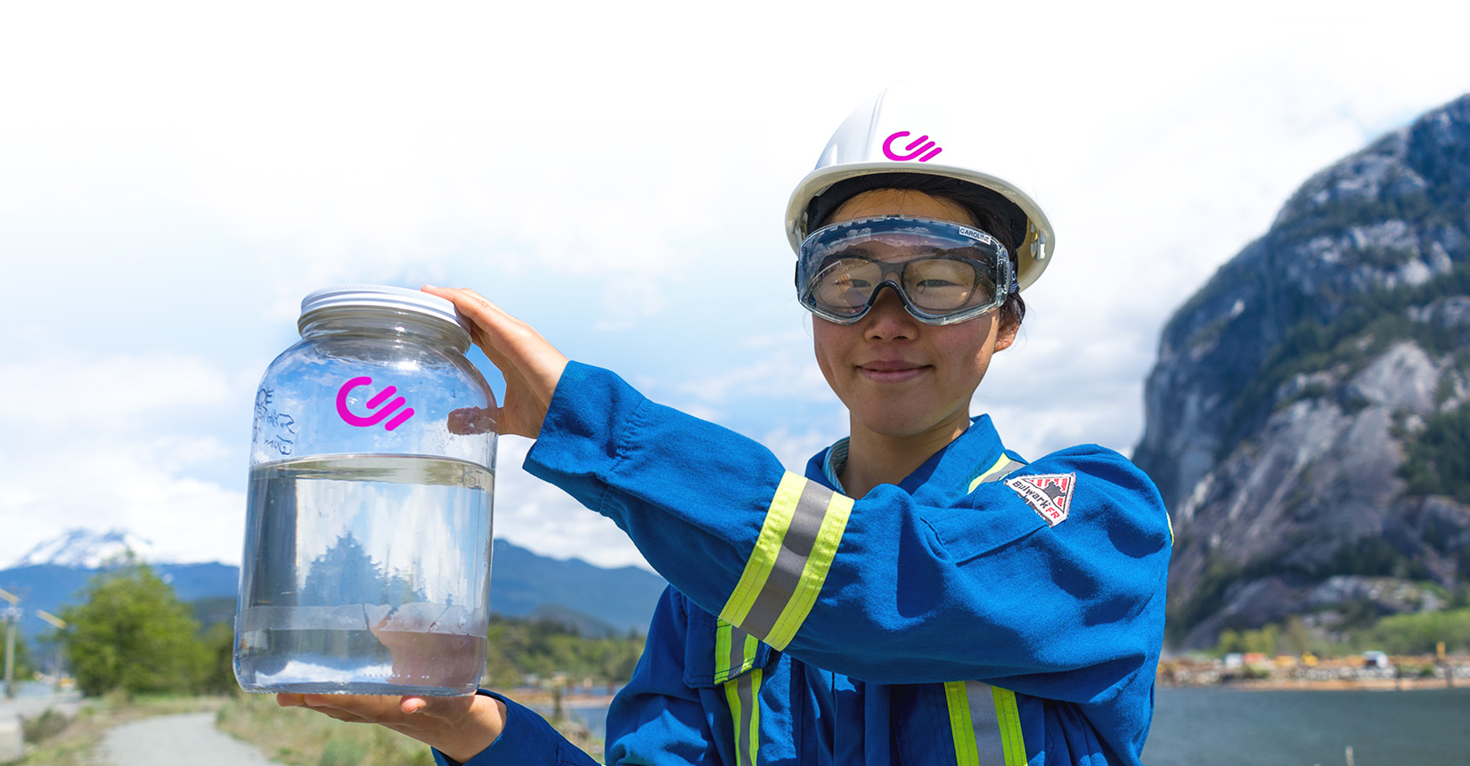 Staff member holding CE's clean fuel made from CO<sub>2</sub> captured from the air and hydrogen split from water.
