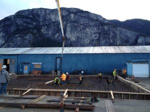 An image of Carbon Engineering's Direct Air Capture technology being built with a mountain in the background.