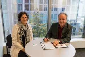 Steve Oldham, CEO of Carbon Engineering, sits at a table with Tina Strehlke, CEO of Minerva