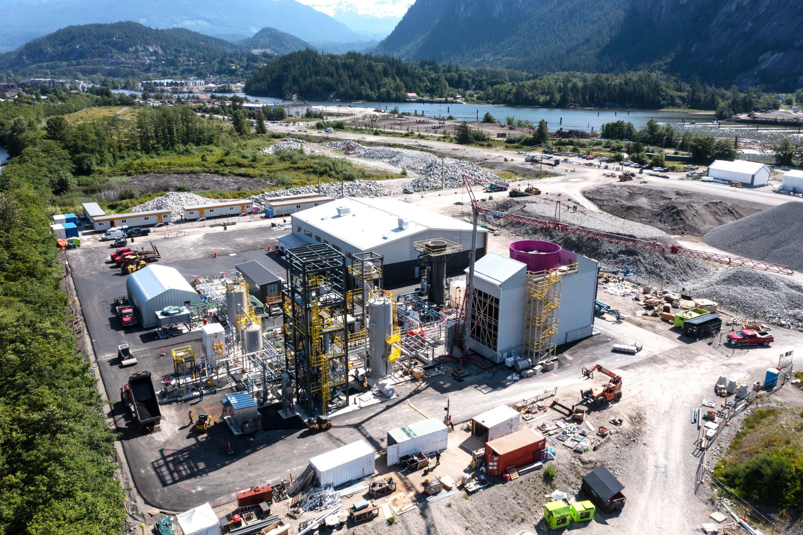 An aerial view of Carbon Engineering's Innovation Centre, with mountains and ocean in the background